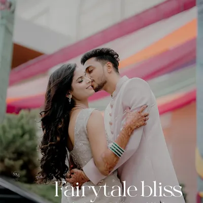 Fairytale bliss. An intimate and romantic kiss against a colorful backdrop, this shot is the epitome of a happy ending turning into a beautiful beginning.