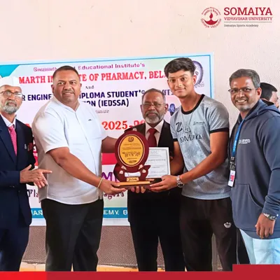 Shreeraj Bodke from K. J. Somaiya Polytechnic receives his gold medal at the IEDSSA Intrazonal Weightlifting Competition, a proud moment for the athlete and his coaches.