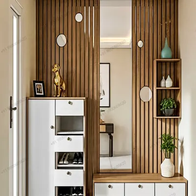 This custom foyer unit features a combination of closed and open shoe storage, a comfortable seating bench, a full-length mirror, and a stylish wooden slat partition for a clean, modern look.