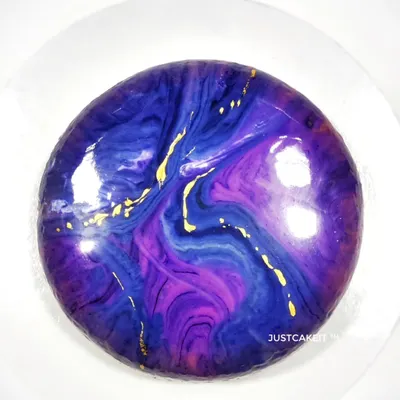 The mirror glaze on this egg-free entremet is like a galaxy. This luxurious French dessert features multiple layers of mousse and cake, offering a complex and refined flavor experience.