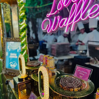 My "Love Waffle" station, featuring a neon sign and beautifully presented milk chocolate delight waffles.