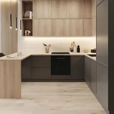 This U-shaped kitchen perfectly balances different textures and tones. I used light wood for the upper cabinets and a dark, solid neutral for the lowers, creating a design that feels both modern and organic.