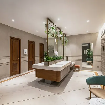 This 1100 sq.ft. washroom block for a farmhouse was designed to feel luxurious while blending into the landscape. The material palette combines greys with wood and brass, complemented by integrated greenery.