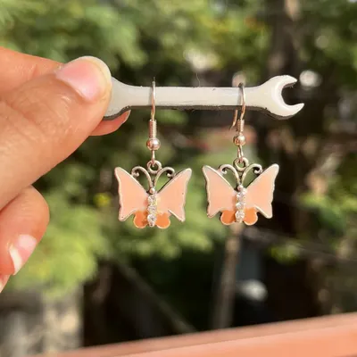 These cute peach butterfly earrings are perfect for adding a whimsical touch to your day. They are part of my collection of earrings under 100/-.