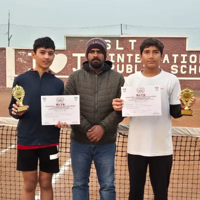 A triple crown for Anay Pandey at the CS7 Tournament in Sonipat. He stands with his coach after winning the U-14 Singles, U-16 Singles, and U-16 Doubles titles.