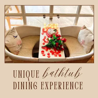 My unique bathtub dining experience is something you won't find anywhere else. This setup, decorated with roses and a custom cake, shows how I can prepare it for a romantic celebration.