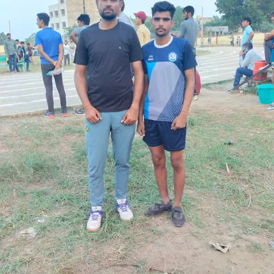 Standing with our promising long jumper who secured a bronze medal at a district meet. Our athletics program is designed to identify and nurture individual talent in track and field events.