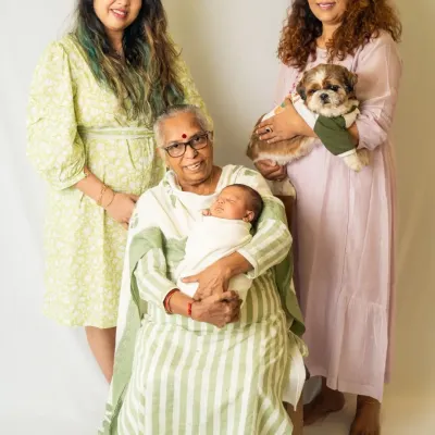 Four generations of love in one beautiful photograph. We were honored to capture this incredible family portrait with the great-grandmother, grandmother, mother, newborn, and family pet.