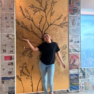 A proud moment with my 85th gold leaf wall mural. Standing next to the finished piece gives a great sense of the scale and how it can become the centerpiece of a room.