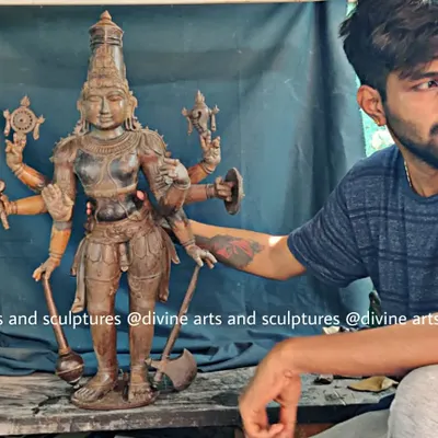 Here is one of our artisans with a wax model of Bhargava Rama (Parashurama). This image shows the scale of the sculpture and the hands-on nature of our craft, connecting the creator with the creation.