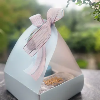 This is the beautiful packaging I use for my Raksha Bandhan hampers. The elegant box, tied with a delicate ribbon, holds a selection of homemade treats, making it a complete and heartfelt gift for your sibling.