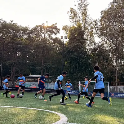 A typical training day at our academy where players are engaged in various dribbling and ball control exercises. My program emphasizes constant movement and repetition to build muscle memory and confidence.