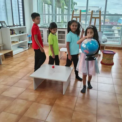 A Birthday Walk is a special tradition at our school. The child holds a globe and walks around a "sun," once for each year of their life, helping them understand the passage of time and their own growth.