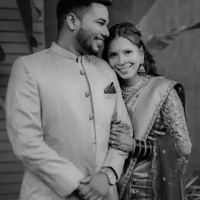 A timeless black and white portrait of Karishma and Bhaskar. The classic monochrome effect emphasizes their happy expressions and strong connection.