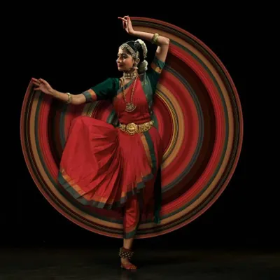 An artistic edit capturing the beautiful circular movements, or 'bhramaris', that are a key part of Bharatanatyam. This photo visualizes the energy and grace of a spin.