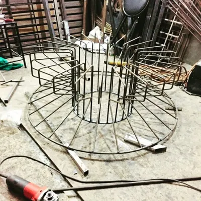 The beginning of our Bloom coffee table. Here, our team is fabricating the intricate metal base, welding each rod into place to create the signature blooming shape.