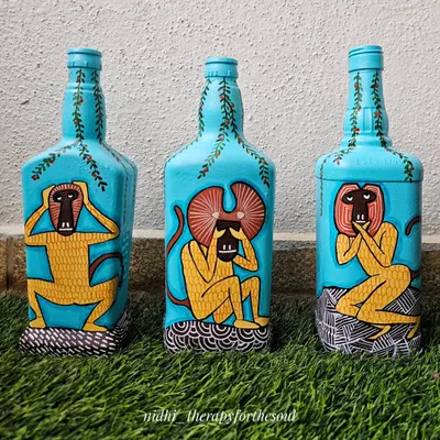 Here is another view of the three wise monkeys bottle art set. The bright turquoise background makes the figures pop, and each bottle tells a part of the story.