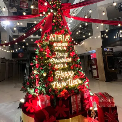 The centerpiece for the Atria Mall's holiday celebration. This Christmas tree installation combined traditional decor with a modern twist, featuring a custom neon sign that lit up the space with festive cheer.