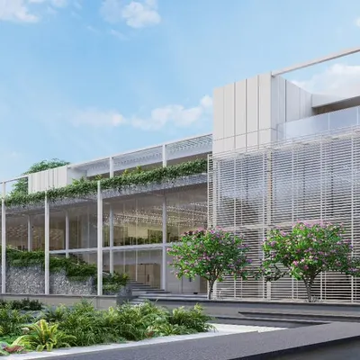 The MOSPO office building in Bangalore features a transparent, multi-story facade with integrated greenery and louvers for sun shading. Our design aims to create a healthy and productive work environment by maximizing natural light and views.