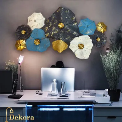This creative metal wall art features a cluster of flowers in blue, white, and gold tones. It's shown here elevating a home office setup, but it is equally suitable for a corporate reception area.