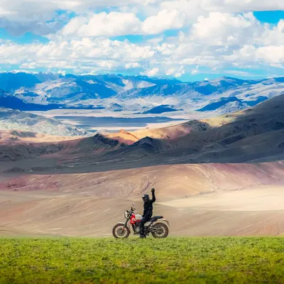 A biker pauses to take in the immense, multi-layered landscape of Ladakh. This shot is part of a series showcasing my self-taught journey and passion for capturing India's beauty.