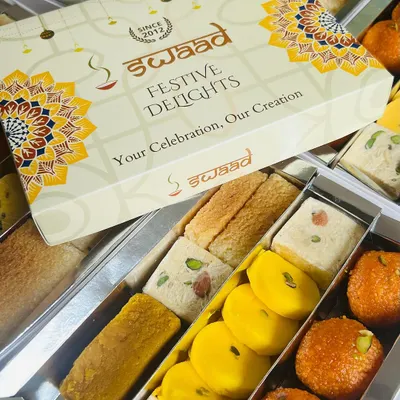 Our 'Festive Delights' box is perfect for corporate gifting, offering a curated selection of our finest sweets. This assorted mithai box includes favourites like Motichoor Ladoo, Peda, and various barfis, all packed under your custom branding.
