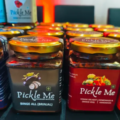 A close-up of our vegetarian stars: the 'Binge All' Brinjal pickle and our 'Veggie Delight' Mixed Veg pickle. Both are handmade with love and fresh farm vegetables.