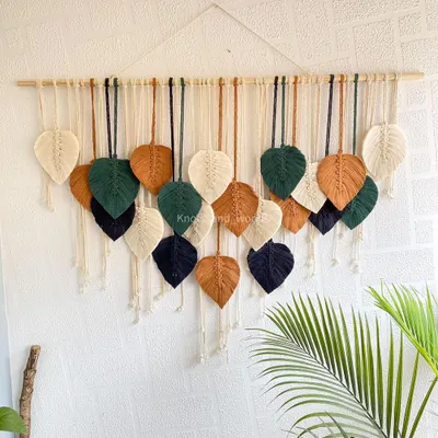 This custom leaf wall hanging was made with a beautiful earthy palette of forest green, navy, brown, and cream. You can choose the number of leaves and the exact colors to create a piece that feels like it was made just for your home.