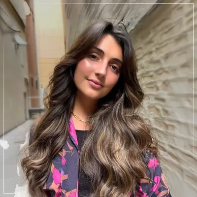 This is the beauty of balayage. Notice how the hand-painted highlights create a seamless, natural-looking gradient that adds dimension and movement, perfectly mimicking how hair lightens in the sun.