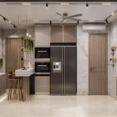 This Gurugram kitchen features a modern minimalist vibe with integrated appliances and a stylish breakfast bar. We used a mix of PU veneer and golden profiles to infuse a sense of luxury.