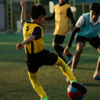 A young player from our U11 squad practices his shooting technique. We focus on repetition and form to ensure skills like striking the ball become second nature.