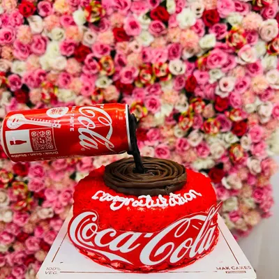 A full view of the gravity-defying Coca-Cola cake. This unique design is always a conversation starter and shows my ability to execute complex, creative concepts.