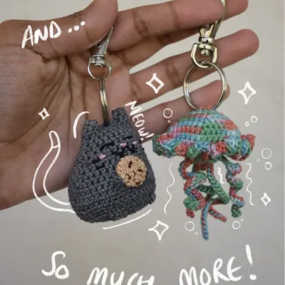 This photo shows the variety of keychains I offer, from a sleepy cat to a colorful jellyfish. Each one is handmade and can be customized.