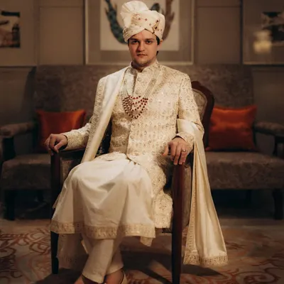 A classic, regal portrait of the groom in his wedding sherwani. I aim to capture a sense of quiet confidence and anticipation on the wedding day.
