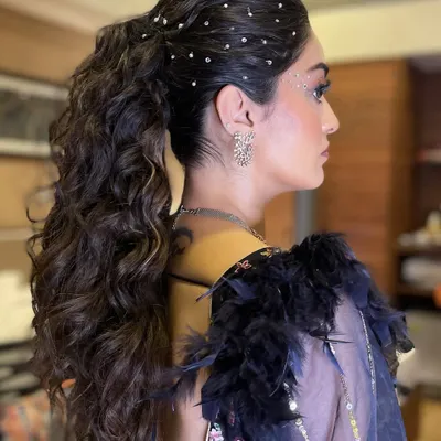 A glamorous ponytail for a sangeet night. I created voluminous curls and scattered delicate crystals throughout the hair for a touch of sparkle that catches the light with every movement.