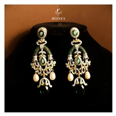 These versatile danglers feature a beautiful arrangement of emeralds, diamonds, and pearl drops. I designed them to be lightweight yet impactful, suitable for any festive outfit.