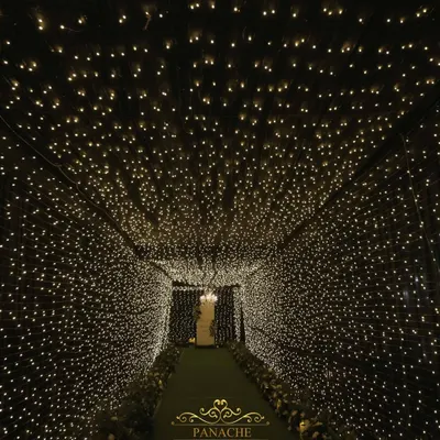 We created a breathtaking entrance for this cocktail night with a tunnel made entirely of fairy lights. It felt like walking through a galaxy of stars, setting a magical tone for the evening.