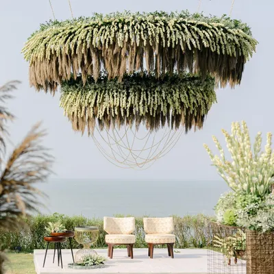 This massive two-tier mandap was created for a beach wedding at W Goa. I'll teach you the structural and floral techniques behind building such a grand installation, which involved five layers of materials including kamini leaves, tuberoses, and locally grown dry grass.