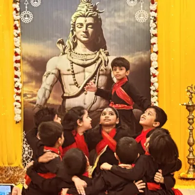 A beautiful moment from our Shivratri performance. I am surrounded by my students, all looking up with bright eyes. This picture captures the connection and adoration that makes teaching children so rewarding.