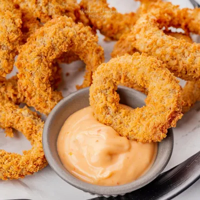 A classic appetizer, the onion ring, shot for The Bermuda Triangle. My focus here was on the crispy texture and golden color, making a simple dish look absolutely irresistible.