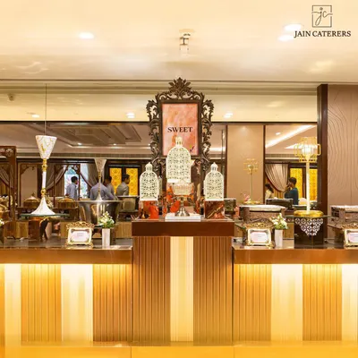 Turning your dessert dreams into a delectable reality. An elegant 'Sweet' station with ornate decor and a variety of beautifully arranged desserts.