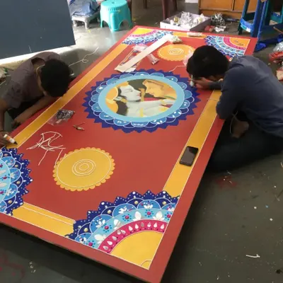 Our team works together on a large custom panel. This collaborative process allows us to complete big projects efficiently while maintaining the high quality of our handmade art.
