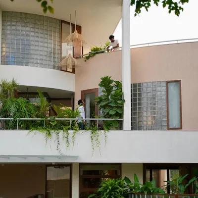 This is a sketch brought to life. The balconies are designed as integral parts of the landscape, with deep planters supporting lush greenery that cascades down the building's facade.