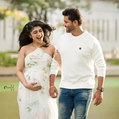A beautiful, candid moment from actress Aditi Prabhudeva's maternity shoot, capturing the laughter and love between the couple.