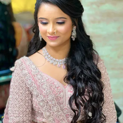 My beautiful engagement bride flaunting in hues of pink. This look features soft, romantic makeup and cascading curls.