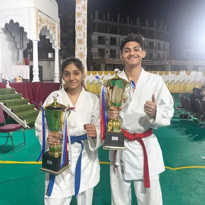 Taran and Shifa celebrating their Grand Championship wins in Kumite. This is the result of their relentless training and a testament to their skill and passion for karate.
