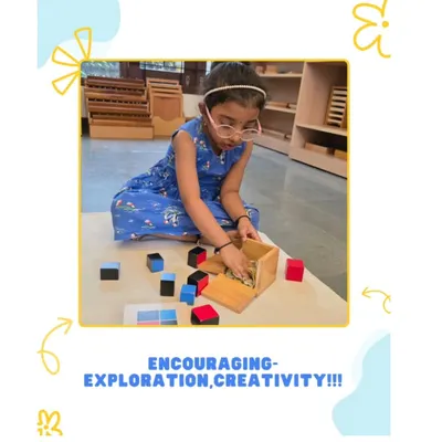 A child deeply engaged with the trinomial cube, a classic Montessori sensorial material. This activity is more than just a puzzle; it's an early, hands-on introduction to algebraic concepts, developing problem solving skills and concentration.