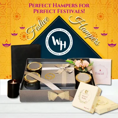 Perfect hampers for perfect festivals. This elegant Diwali gift box combines a sleek leather-style journal with gourmet treats and a scented candle for a modern festive feel.