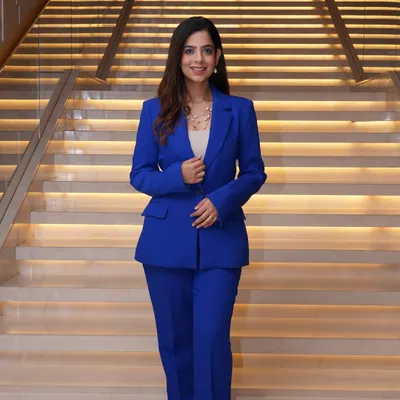A powerful look in a tailored royal blue suit. For corporate events, a sharp suit helps me command the room with confidence and style.
