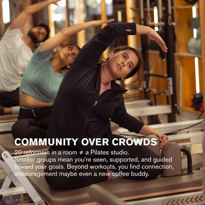 We prioritize community over crowds. Smaller groups mean I can give you the support and guidance you need to reach your goals. Here, a client gets a hands on assist during a stretch.